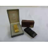 Dunhill gold plated cigarette lighter in original packaging and a Dunhill leather case with original