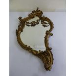 A Continental gilt wood and gesso wall mirror in Rococo style