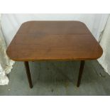 An Edwardian mahogany games table on tapering rectangular legs