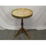 A French style marble top side table with gilt metal gallery on tripod base