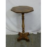 A mahogany pedestal base plant stand with hexagonal top on quatrefoil base