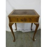 An early 20th century mahogany rectangular side table, tooled leather top and single drawer on
