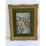 An oil on canvas of Continental street scene in decorative gilded frame, signed bottom left, 29 x