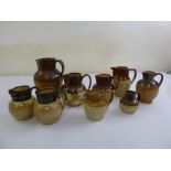 A quantity of harvest jugs of various sizes mostly Doulton, A/F, (9)