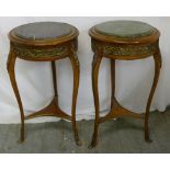 Two Continental mahogany circular side tables with gilded metal mounts and detachable marble tops