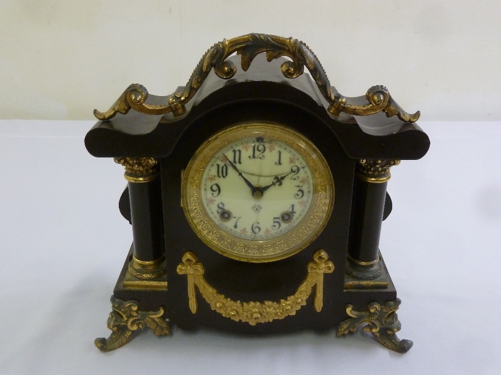 A black marble mantle clock with gilt metal mounts, Roman numerals to the enamel dial, A/F