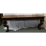 A French Empire mahogany consol table, rectangular with two stylised lion supports