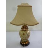 A Chinese style porcelain table lamp with silk shade