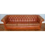 A Victorian leather Chesterfield of customary form