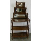 A Victorian mahogany six shelf shaped rectangular whatnot with baluster turned columns and mirror