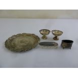 A quantity of silver to include a pair of pierced bonbon dishes, oval mustard pot, glass pin jar