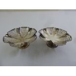 Two silver scroll pierced bonbon dishes on raised circular bases, Sheffield 1935 by Edward Viner