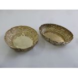 A matched pair of Victorian silver oval bowls, the sides chased with fruits and flowers, London 1892