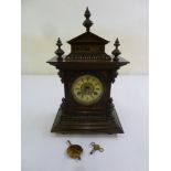 An Edwardian oak cased mantle clock, two train movement, Roman numerals, to include key and