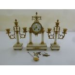 A French marble and Ormolu mantle clock set, two train movement to include keys and pendulum