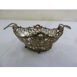 A 19th century Dutch silver oval pierced bonbon basket with scroll side handles, import marks London