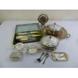 A quantity of silver plate to include covered vegetable dishes and a cased carving set