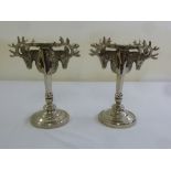 A pair of Kenneth Turner silver plated stag candle holders, signed to the base
