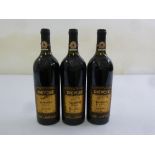 Three numbered bottles of 1998 Dievole Nouvecento Reserva Chianti Classico with wax seals to