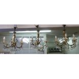 Two six branch bronze and crystal chandeliers, one three branch and four two branch side lights