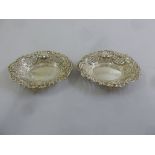 Two oval pierced silver embossed bonbon dishes