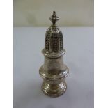 A George III style silver sugar castor, vase form with pierced pull off cover, London 1977