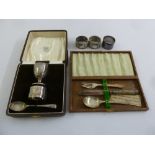 A quantity of silver to include a cased egg cup set Birmingham 1937, a cased christening set and