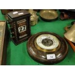 An oak perpetual desk calendar and an aneroid barometer in carved mount.