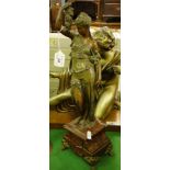 A spelter figure of a lady on marble plinth.
