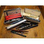 Vintage fountain pens including Cross and Parker.