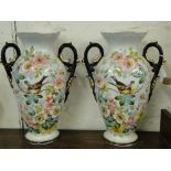 A pair of Edwardian painted porcelain vases, with designs of swallows and blossom, height 15.5".