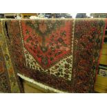 A red ground Balochi rug.