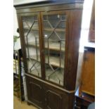 A large 19th century mahogany 4-door corner cupboard.