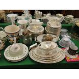 An extensive white and gold decorated dinner service including tureens and meat plates,