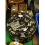 A Chinese circular rosewood box with mother of pearl inlay and fitted inner trays, 10.