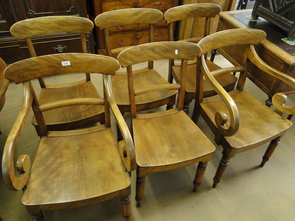 A set of 6 19th century mahogany and panel seated dining chairs with turned legs.