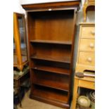 A modern mahogany floor standing open bookcase with adjustable shelves.