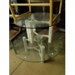 Pair of graduated glass top coffee tables on faux bamboo stands.