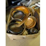 A large box of treen bowls and ornaments.