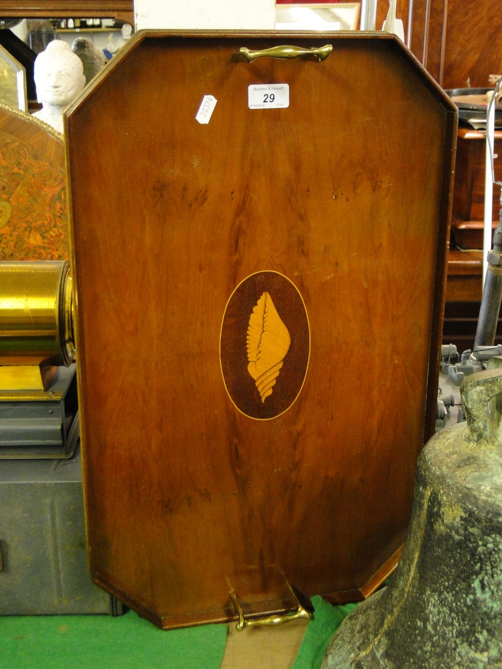 A yewwood tea tray with shell marquetry and brass handles.