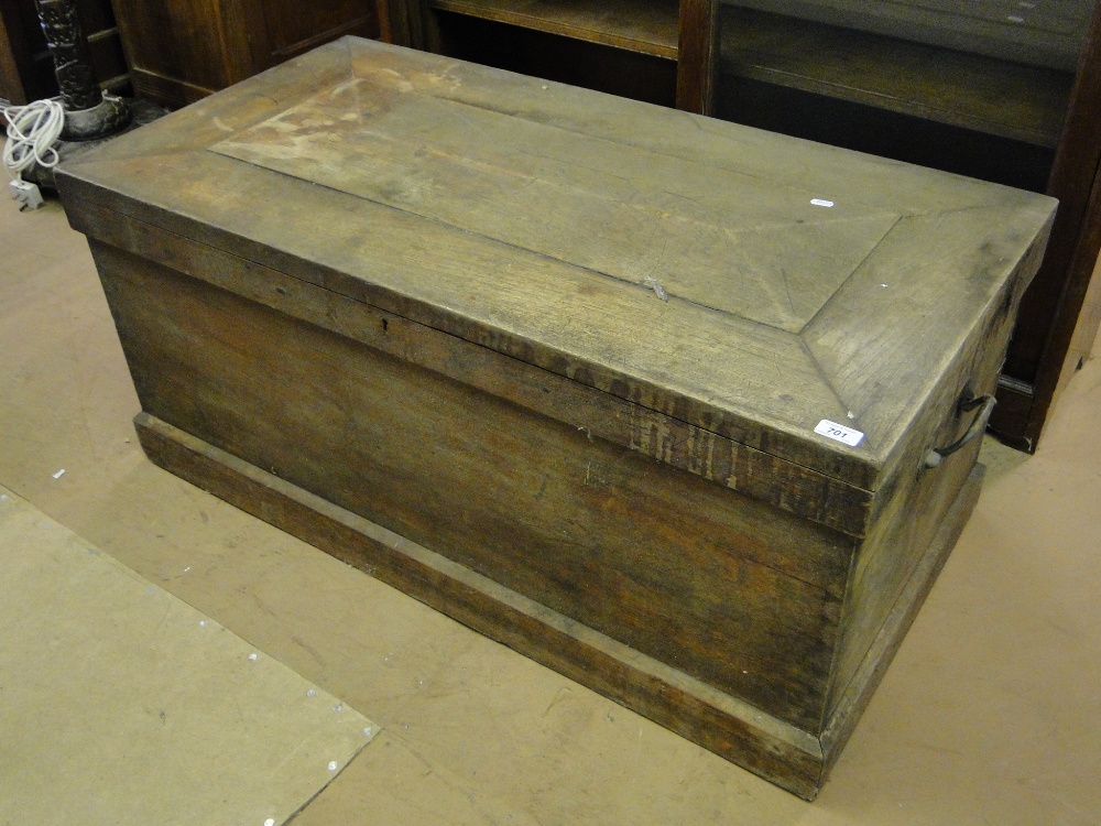 A 19th century teak blanket chest with carrying handles.