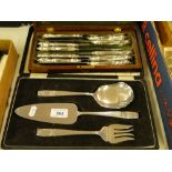 An Elkington plate 3-piece cased serving set, and a cased set of 10 silver handled dinner knives.