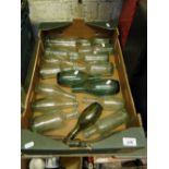 Tray of Vintage green glass cod and other bottles.