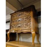 A carved oak 3 drawer chest.