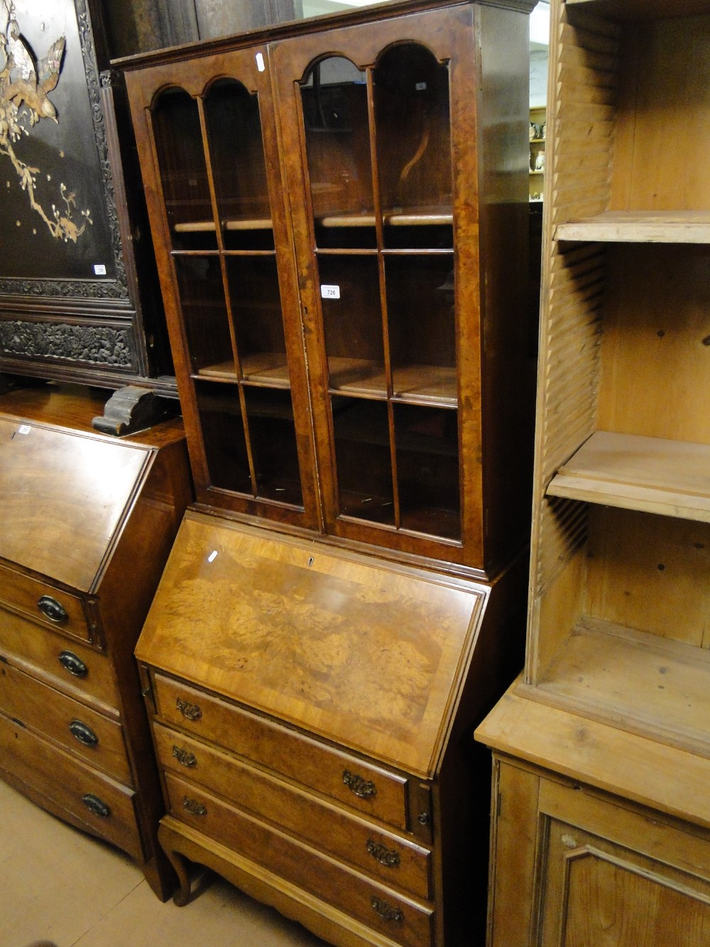 A 1930s burr walnut bureau bookcase.