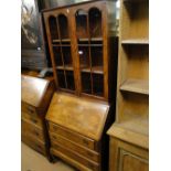 A 1930s burr walnut bureau bookcase.