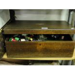 A teak sewing box and contents.