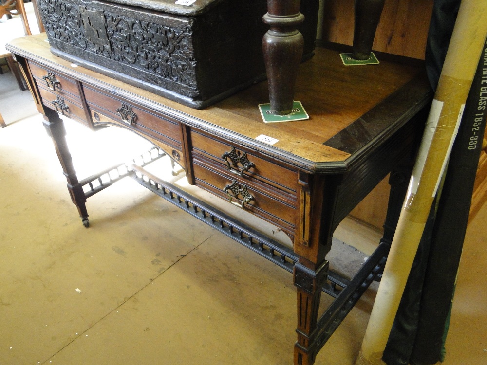 A 19th century mahogany writing desk with fitted drawers and square tapered legs.