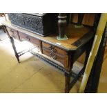 A 19th century mahogany writing desk with fitted drawers and square tapered legs.