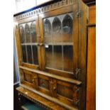 An oak 2-door bookcase with lead light glazed doors.